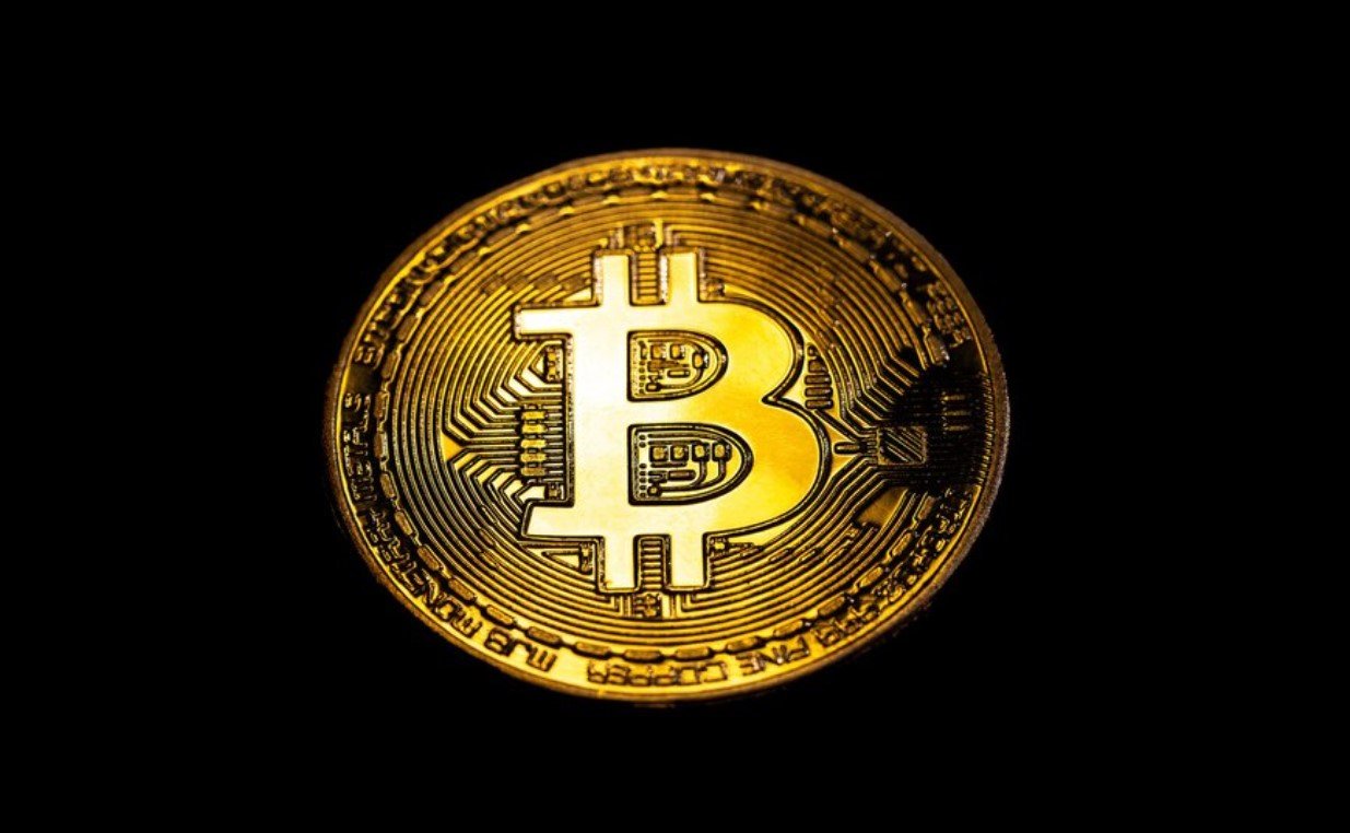 Bitcoin logo with gold coins