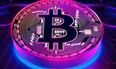 neon glowing bitcoin logo on a blue computer chip background