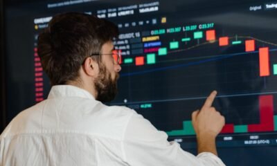 concerned investor looking at crypto screen crash getty