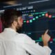 concerned investor looking at crypto screen crash getty